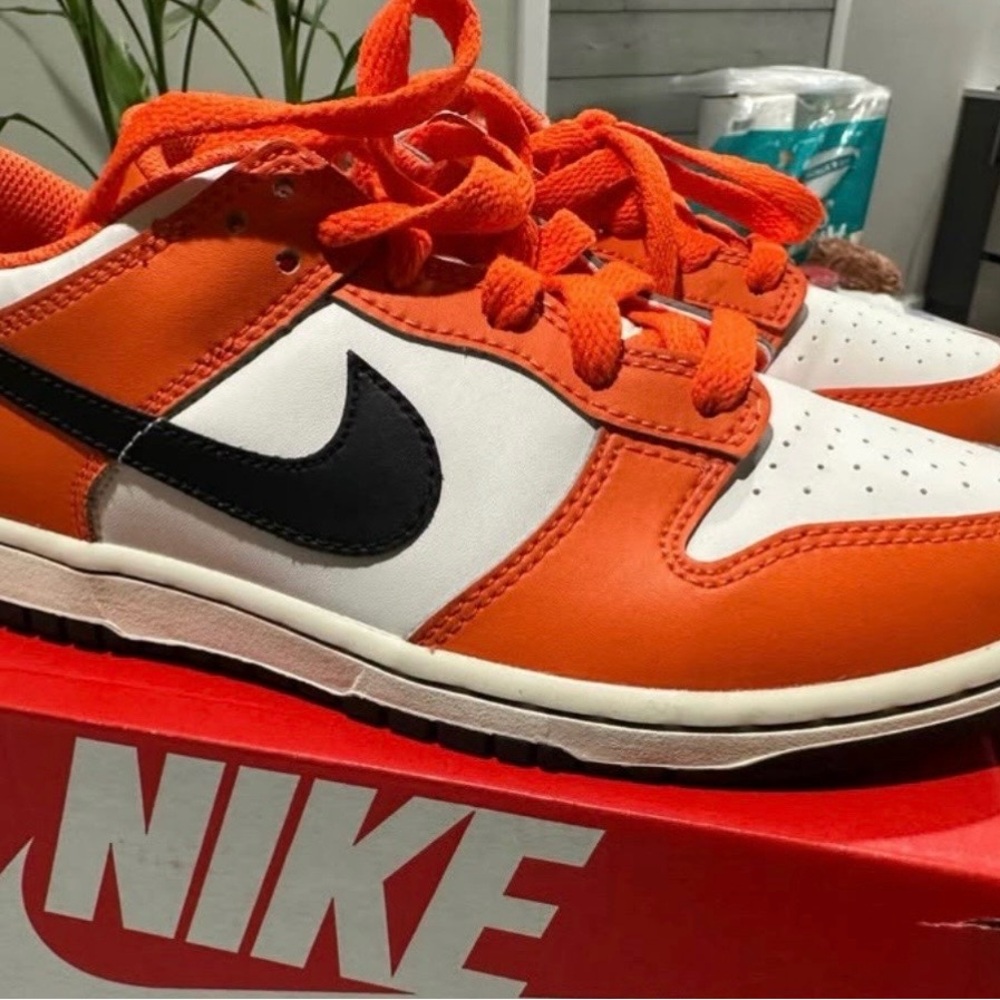 Nike Dunk Low PS "Halloween" 2022 in the phantom, black, and safety orange